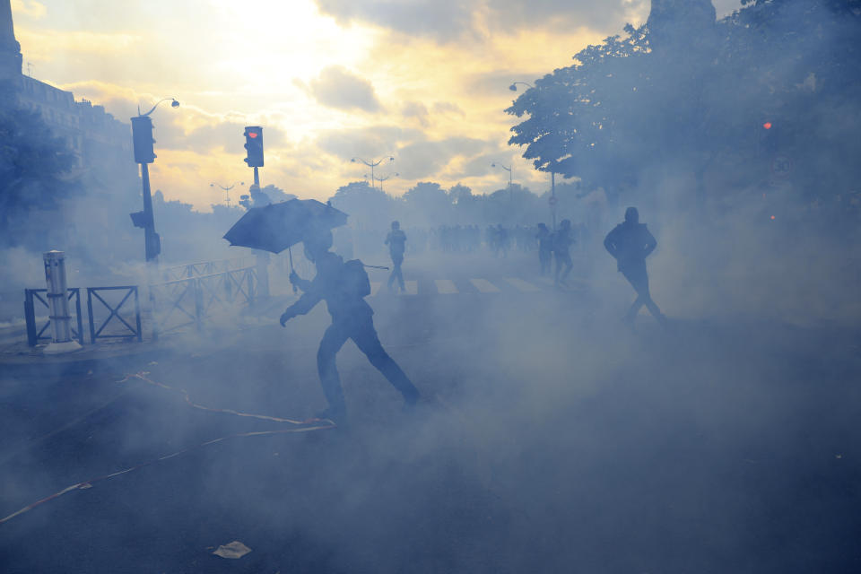 Youths move on the street during a demonstration, Monday, May 1, 2023 in Paris. Across France, thousands marched in what unions hope are the country's biggest May Day demonstrations in years, mobilized against President Emmanuel Macron's recent move to raise the retirement age from 62 to 64. (AP Photo/Aurelien Morissard)