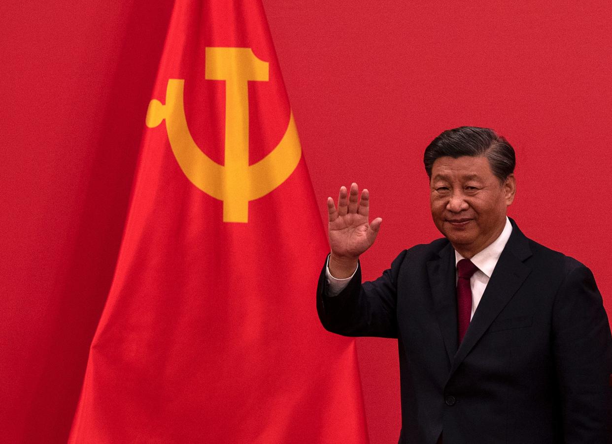 General Secretary and Chinese President Xi Jinping waves as he leaves after speaking at a press event with Members of the new Standing Committee of the Political Bureau of the Communist Party of China and Chinese and Foreign journalists at The Great Hall of People on October 23, 2022 in Beijing, China.
