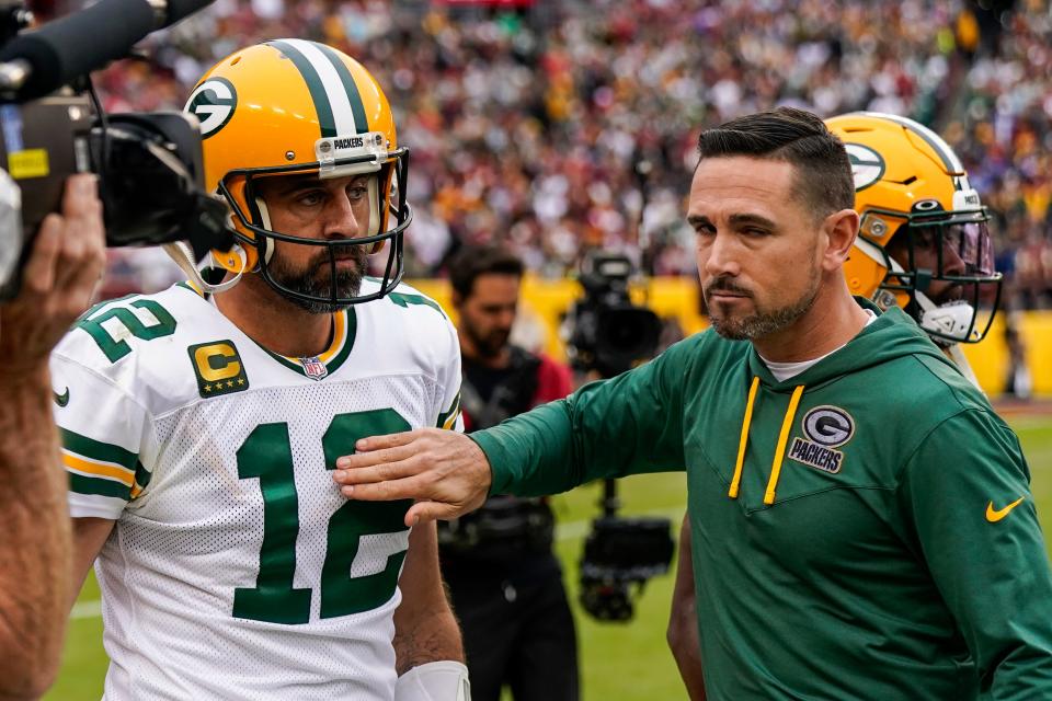 Aaron Rodgers and head coach Matt LaFleur react during the Green Bay Packers' loss to the Washington Commanders on Oct. 23, 2022.