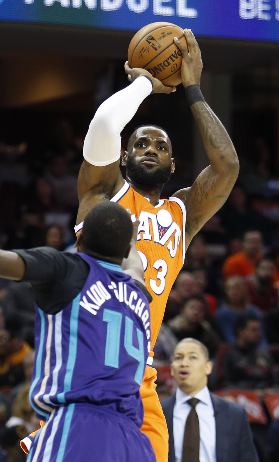 Cleveland Cavaliers' LeBron James (23) shoots over Charlotte Hornets' Michael Kidd-Gilchrist during the first half of an NBA basketball game Saturday, Dec 10, 2016, in Cleveland. (AP Photo/Ron Schwane)