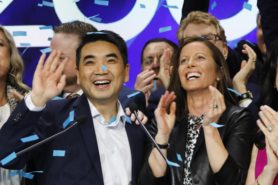 Zoom CEO Eric Yuan, left, and Adena Friedman, President and CEO of Nasdaq, attend the opening bell at Nasdaq as his company holds its IPO, Thursday, April 18, 2019, in New York. (AP Photo/Mark Lennihan)