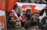 Protesters attend a rally in downtown Minsk, Belarus, Saturday, Dec. 7, 2019. More than 1,000 opposition demonstrators are rallying in Belarus to protest closer integration with Russia. Saturday's protest in the Belarusian capital comes as Belarusian President Alexander Lukashenko is holding talks with Russian President Vladimir Putin in Sochi on Russia's Black Sea coast. (AP Photo/Sergei Grits)