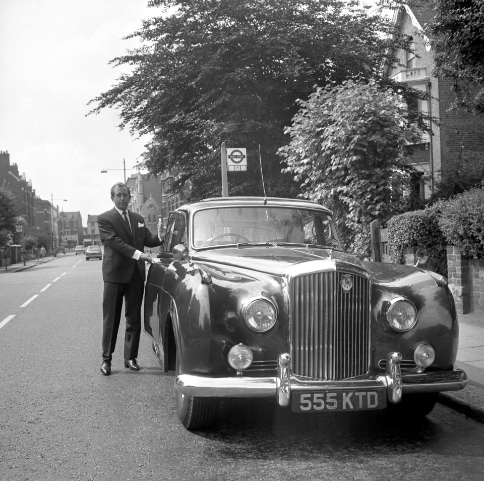 West End club proprietor Paul Raymond with his Bentley in London, after he had elected at Wimbledon to go for trial, charged with driving his car while under the influence of alcohol.