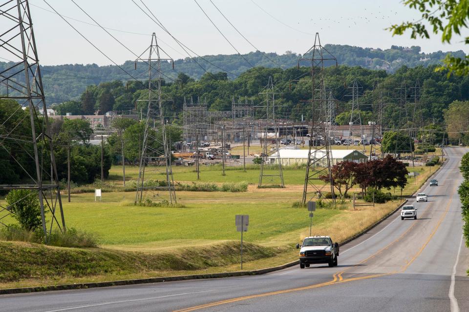 Looking south on Pennsylvania Avenue from Route 30 across a field where a proposed warehouse or other industrial development would be visible. In the background is the Met-Ed property beyond the building with the white roof.