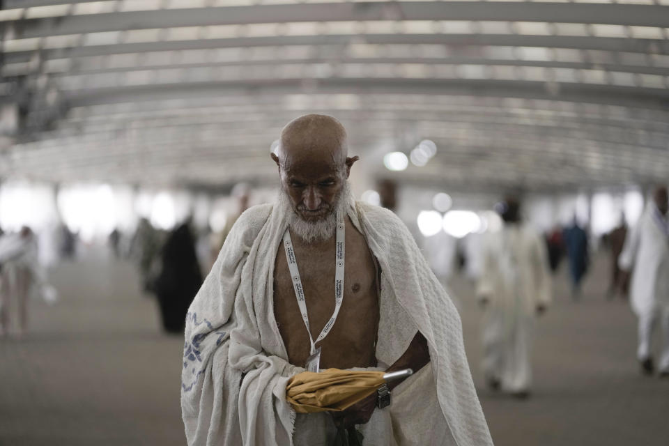 An Iranian pilgrim walks to cast stones at a pillar in the symbolic stoning of the devil, the last rite of the annual Hajj pilgrimage, in Mina near the holly city of Mecca, Saudi Arabia, Thursday, June 29, 2023. (AP Photo/Amr Nabil)