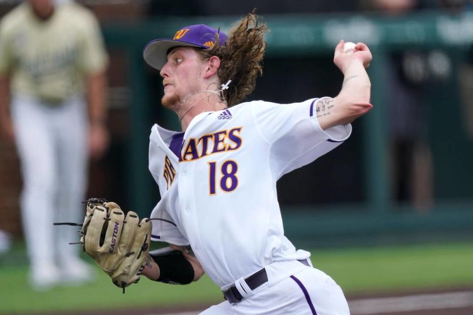 East Carolina starting pitcher Carson Whisenhunt throws against Vanderbilt during the second inning of an NCAA college baseball super regional game Saturday, June 12, 2021, in Nashville, Tenn. (AP Photo/Mark Humphrey)