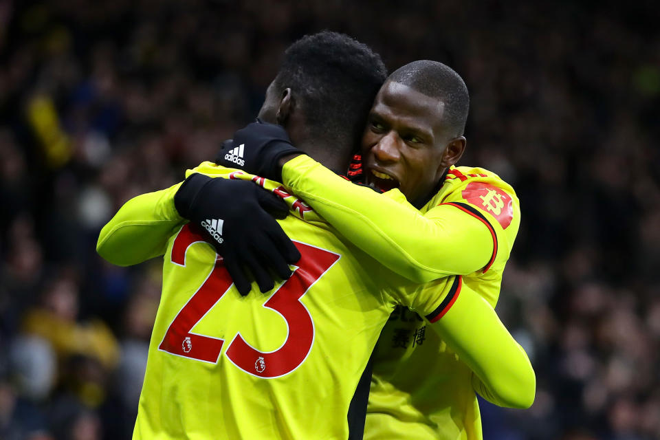 WATFORD, ENGLAND - FEBRUARY 29: Ismaila Sarr of Watford celebrates after scoring his team's first goal with teammate Abdoulaye Doucoure during the Premier League match between Watford FC and Liverpool FC at Vicarage Road on February 29, 2020 in Watford, United Kingdom. (Photo by Richard Heathcote/Getty Images)