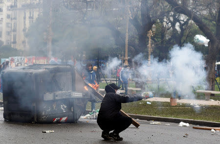 Protesters are seen amidst smoke during clashes with the police outside the Congress, where the budget bill is being debated, in Buenos Aires, Argentina October 24, 2018. REUTERS/Martin Acosta