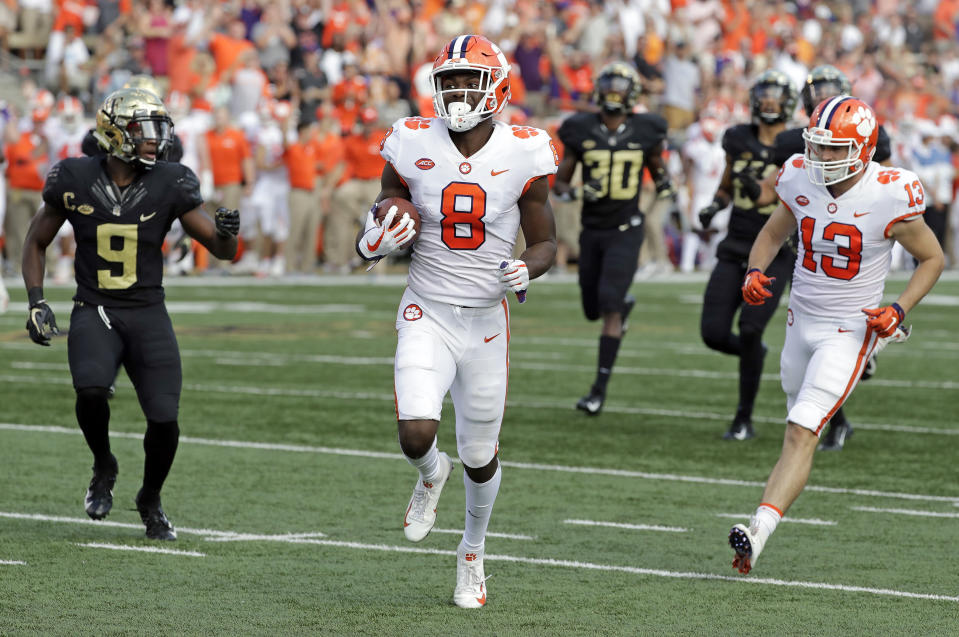 Clemson's Justyn Ross (8) runs past Wake Forest's Chuck Wade Jr. (9) for a touchdown during the first half of an NCAA college football game in Charlotte, N.C., Saturday, Oct. 6, 2018. (AP Photo/Chuck Burton)