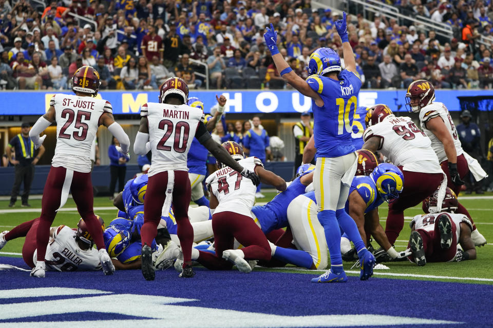 Players react as Los Angeles Rams running back Kyren Williams (23) scores a touchdown during the first half of an NFL football game against the Washington Commanders Sunday, Dec. 17, 2023, in Inglewood, Calif. (AP Photo/Marcio Jose Sanchez)