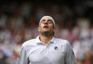 Tennis - Wimbledon - All England Lawn Tennis and Croquet Club, London, Britain - July 13, 2018 John Isner of the U.S. reacts during his semi final match against South Africa's Kevin Anderson. Ben Curtis/Pool via Reuters