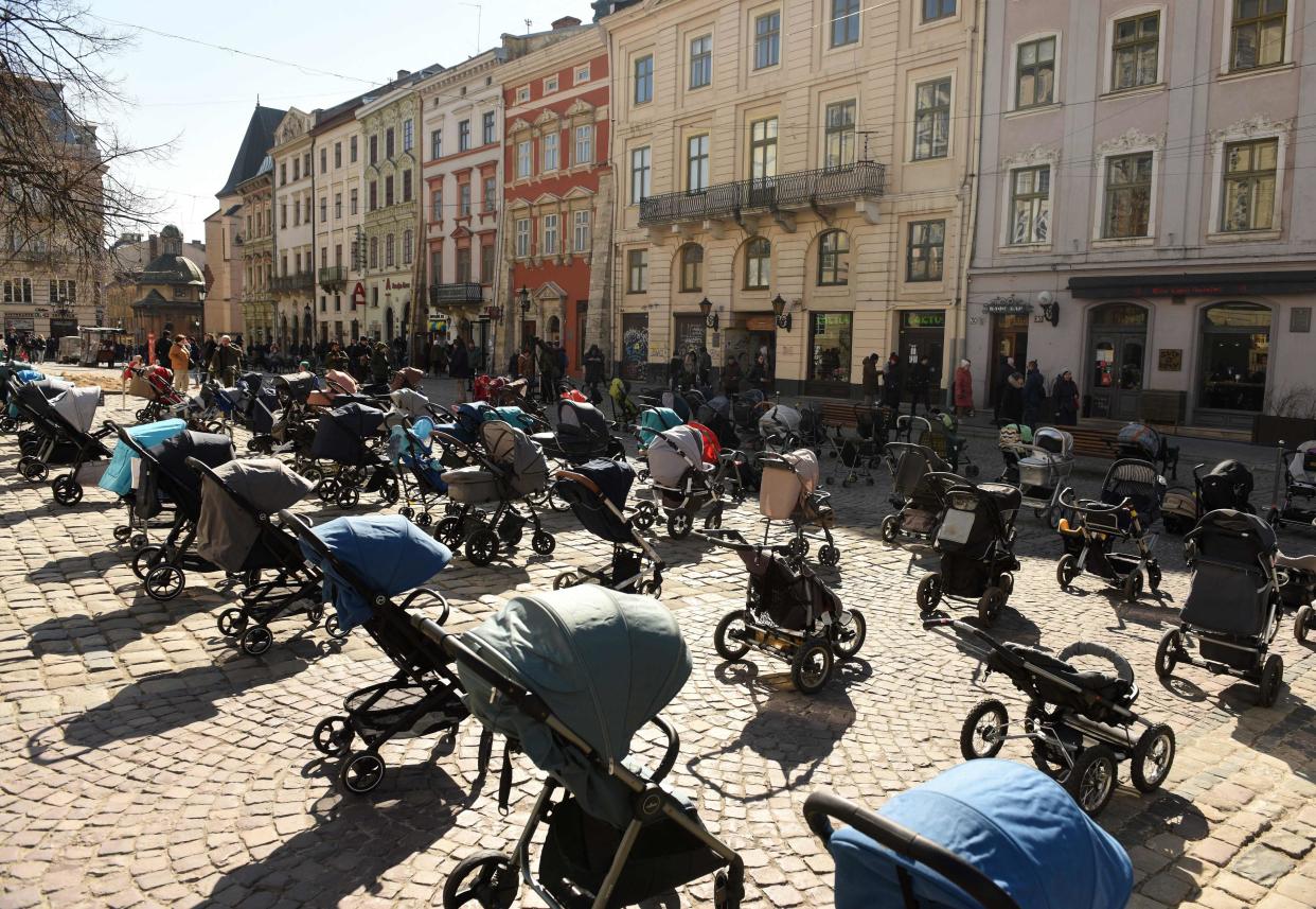 109 empty strollers placed outside the Lviv city council on March 18, 2022 commemorate the number of children killed in Russia's ongoing invasion of Ukraine.