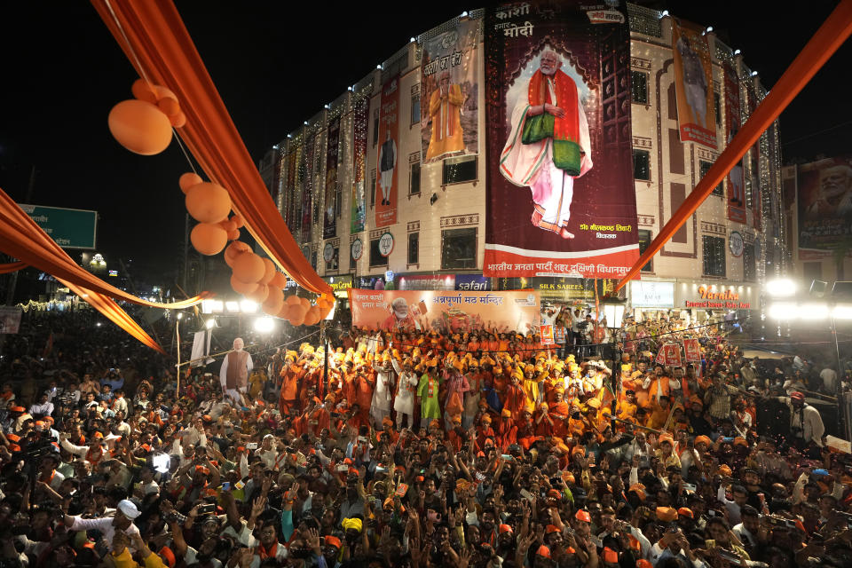 FILE-Supporters of Bharatiya Janata Party (BJP) gather to greet Indian Prime Minister Narendra Modi during a roadshow in Varanasi, India, Monday, May 13, 2024. (AP Photo/Rajesh Kumar, file)