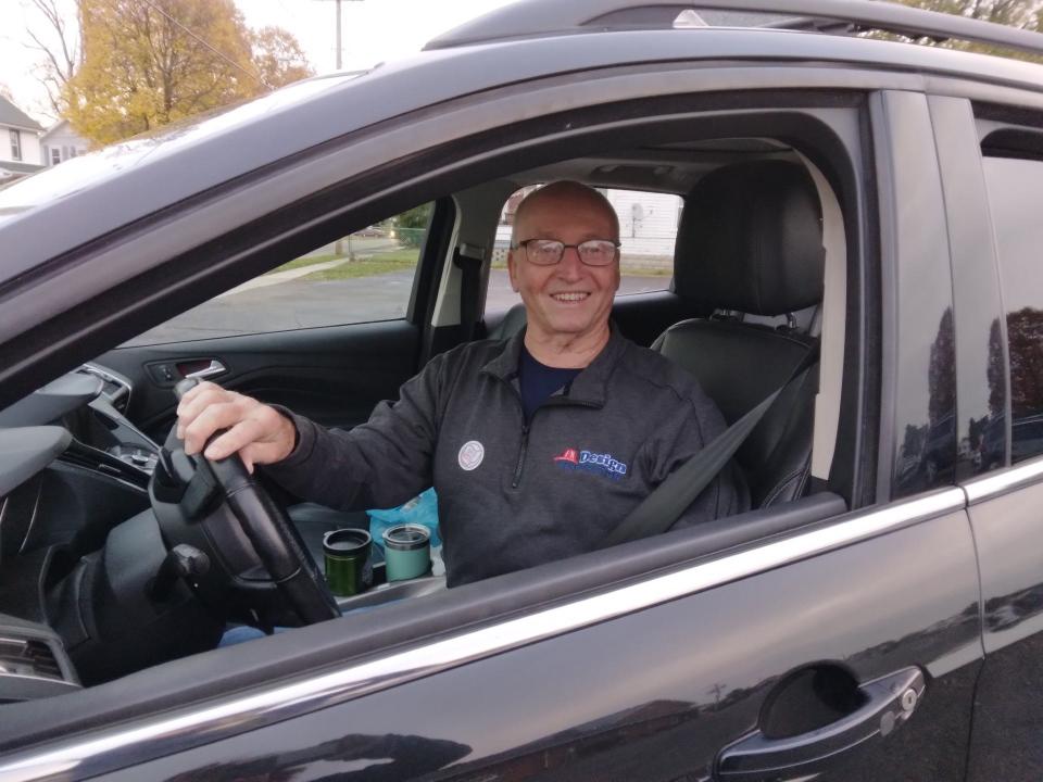 Michael Richmond voted shortly after 7 a.m. at Christ United Methodist Church, which is within view of his home in Louisville. He and his daughters have an Election Day tradition. They send each other photos of them wearing stickers they received after voting.