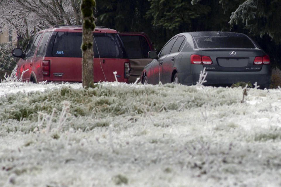 This image made from a video provided by KGW, shows the scene Wednesday, Jan. 17, 2024, in Portland, Ore, after a power line fell on a vehicle, killing three people and injuring a baby during an ice storm that turned roads and mountain highways treacherous in the Pacific Northwest. (KGW via AP)