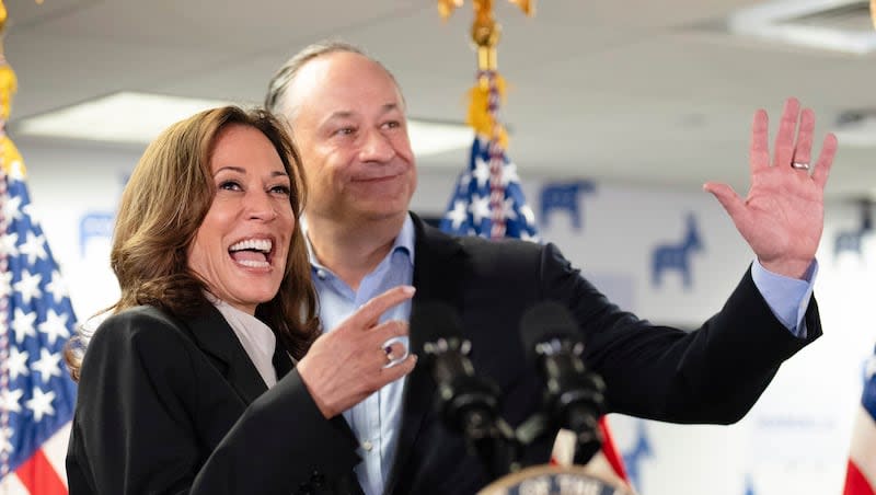 Vice President Kamala Harris, left, and second gentleman Doug Emhoff address staff at her campaign headquarters in Wilmington, Del., Monday, July 22, 2024. Harris has secured support from a majority of Democratic delegates, offering her a clear path to the party’s nomination.