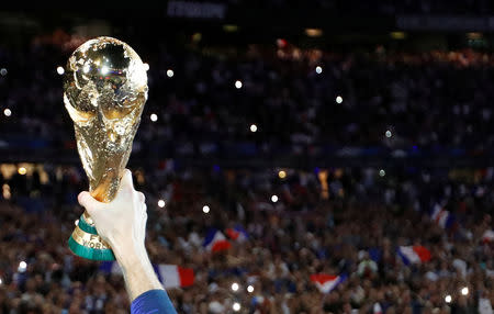 FILE PHOTO: Soccer Football - UEFA Nations League - League A - Group 1 - France v Netherlands - Stade de France, Saint-Denis, France - September 9, 2018 France players celebrates with the World Cup trophy during a ceremony after the match REUTERS/Charles Platiau/File Photo