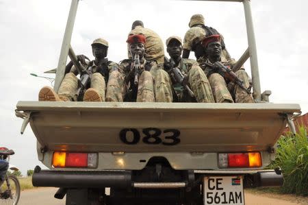 South Sudan National security members ride on their truck as they protect internally displaced people during a reallocation at the United Nations Mission in South Sudan (UNMISS) compound at the UN House in Jebel, in South Sudan's capital Juba, August 31, 2016. REUTERS/Jok Solomun