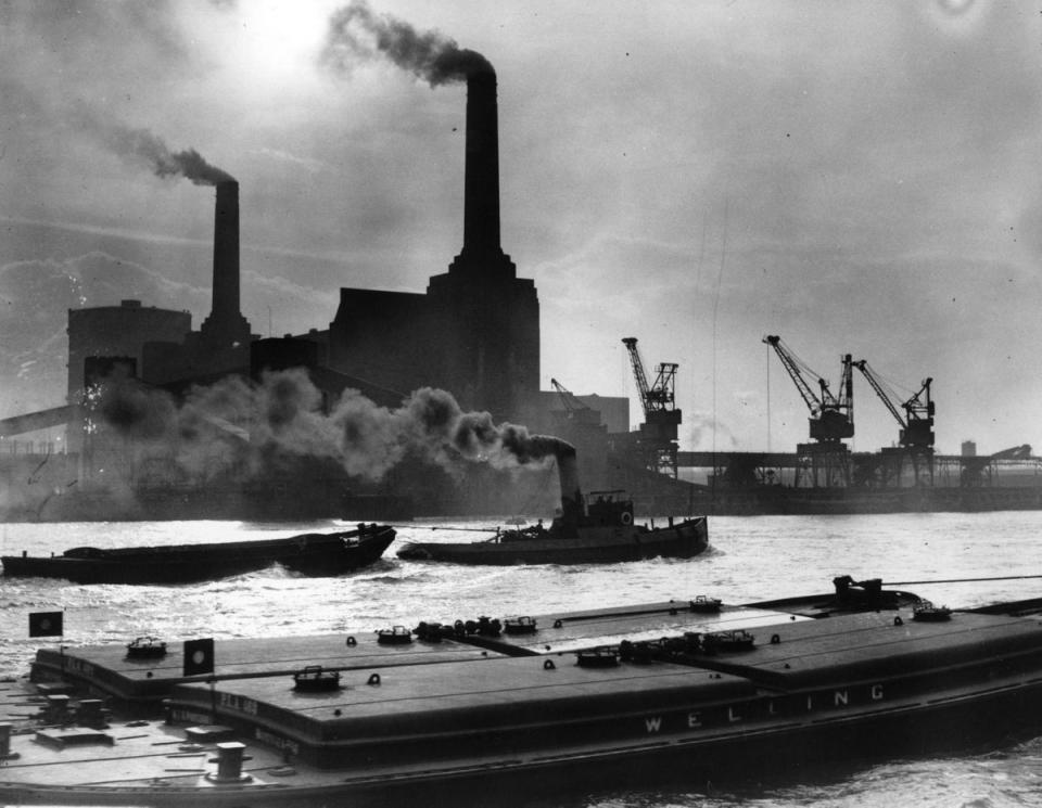 12th February 1937: Smoke belches from the famous chimneys of London's Battersea Power Station. (Getty Images)