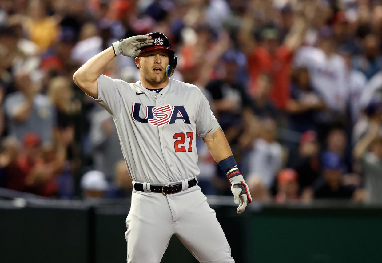 March 15: Mike Trout celebrates with a salute after hitting a triple in the first inning against Colombia.