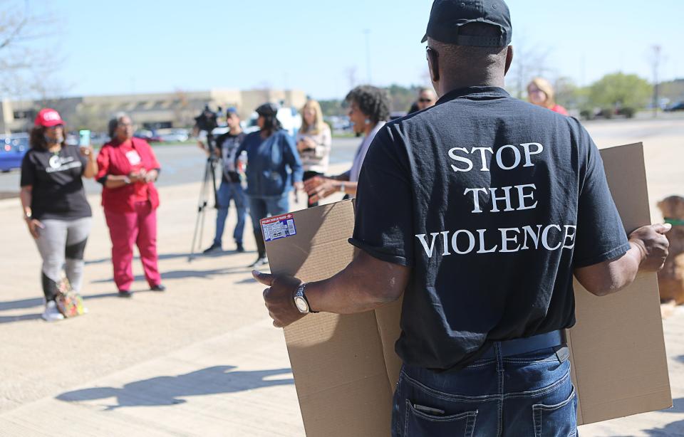 Various organizations held a prayer circle in the parking lot of the Christiana Mall on Monday April 10, 2023 two days after a shooting in the food court injured three people.