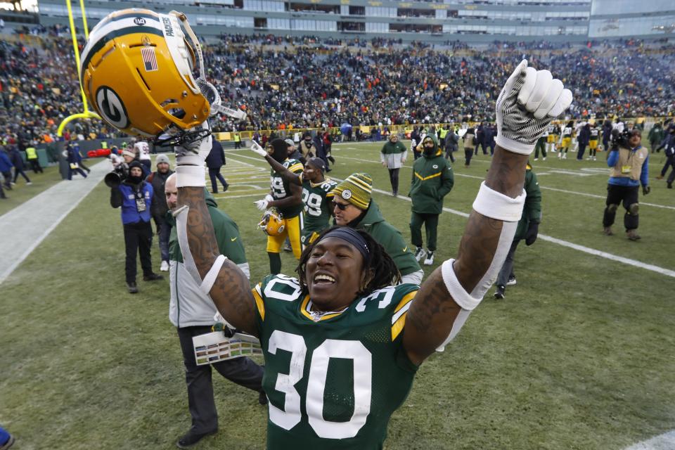 Green Bay Packers' Jamaal Williams celebrates as he leaves the field after an NFL football game against the Chicago Bears Sunday, Dec. 15, 2019, in Green Bay, Wis. The Packers won 21-13. (AP Photo/Mike Roemer)