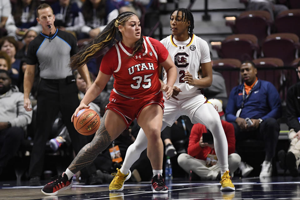 Utah forward Alissa Pili is guarded by South Carolina forward Ashlyn Watkins in the first half of of their game as part of the Women’s Hall of Fame Showcase in Uncasville, Connecticut, on Sunday. (AP Photo/Jessica Hill)