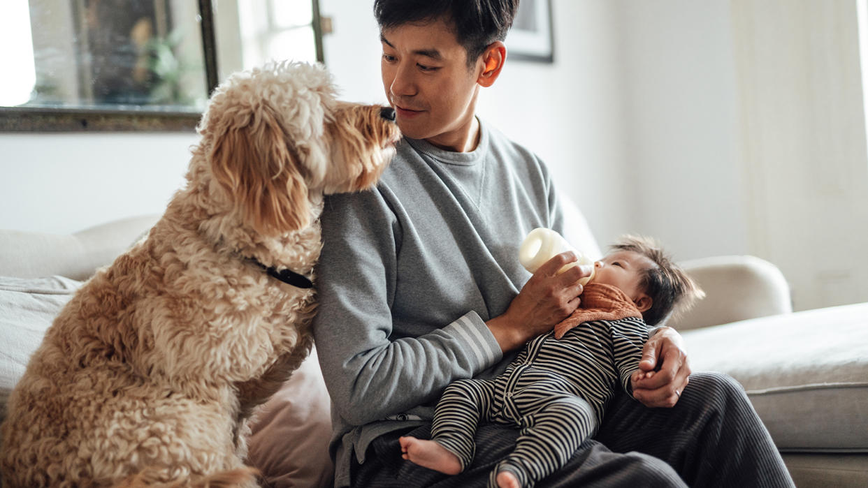  Stay-at-home dad taking care of his baby 