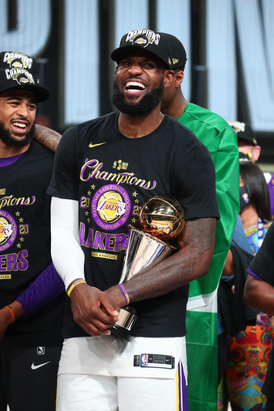 LeBron James #23 of the Los Angeles Lakers holds the Larry O'Brien Trophy and The Bill Russell NBA Finals MVP Award after winning Game Six of the NBA Finals on October 11, 2020