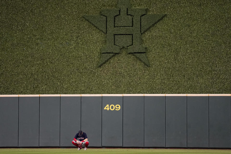 Boston Red Sox center fielder Enrique Hernandez waits in the outfield during the eighth inning in Game 6 of baseball's American League Championship Series Houston Astros Friday, Oct. 22, 2021, in Houston. (AP Photo/David J. Phillip)