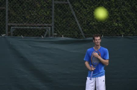 Andy Murray of Britain practices at the Wimbledon Tennis Championships in London June 29, 2014. REUTERS/Toby Melville