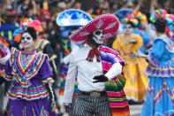 <p>People are seen participate during the traditional Skulls Parade as part of Day of the Dead celebrations at Reforma Avenue on Oct. 28, 2017 in Mexico City, Mexico. (Photo: Carlos Tischler/NurPhoto via Getty Images) </p>