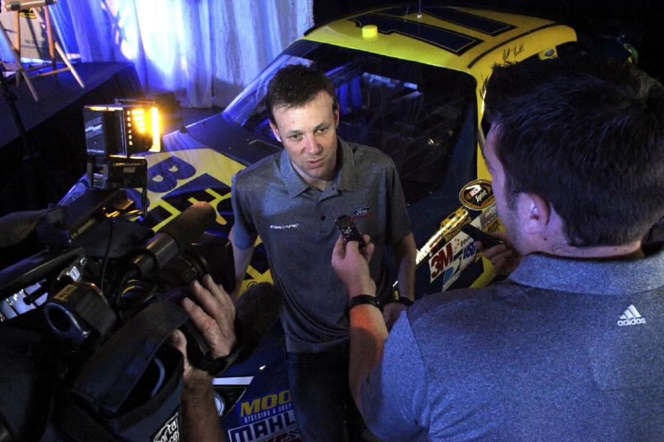 NASCAR driver Matt Kenseth speaks with the media at the Louisville Assembly Plant Tuesday, May 15, 2012, in Louisville, Ky., during the unveiling of the Ford Escape that will be the pace car for next month's NASCAR auto race at Kentucky Speedway. (AP Photo/The Courier-Journal, Aaron Borton) NO SALES; MAGS OUT; NO ARCHIVE; MANDATORY CREDIT