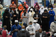 Worshippers perform an Eid al-Fitr prayer at the Masjidullah Mosque in Philadelphia, Thursday, May 13, 2021. Millions of Muslims across the world are marking a muted and gloomy holiday of Eid al-Fitr, the end of the fasting month of Ramadan - a usually joyous three-day celebration that has been significantly toned down as coronavirus cases soar. (AP Photo/Matt Rourke)