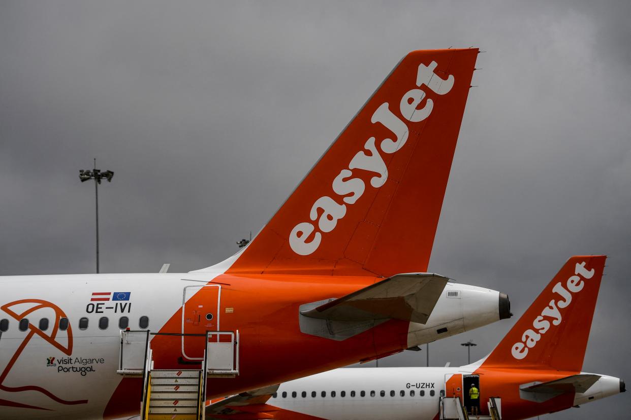 EasyJet aircrafts are pictured at Faro airport in Algarve, south of Portugal, on June 15, 2021. - British airline EasyJet inaugurated a new base in Faro, in southern Portugal, shortly after the opening of another in Malaga, in southern Spain, betting on the resumption of tourism. (Photo by PATRICIA DE MELO MOREIRA / AFP) (Photo by PATRICIA DE MELO MOREIRA/AFP via Getty Images)