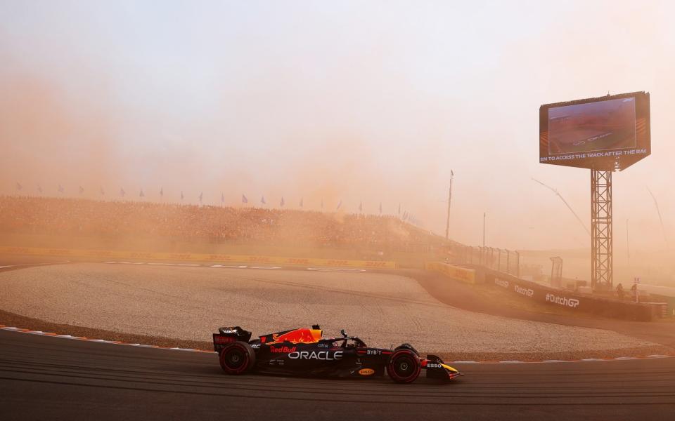 ZANDVOORT, NETHERLANDS - SEPTEMBER 04: Race winner Max Verstappen of the Netherlands driving the (1) Oracle Red Bull Racing RB18 waves to the crowd during the F1 Grand Prix of The Netherlands at Circuit Zandvoort on September 04, 2022 in Zandvoort, Netherlands - Alex Pantling/Formula 1