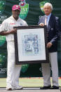 2005: Richie Benaud presents Brian Lara with this photograph commemorating his world record Test run tally.