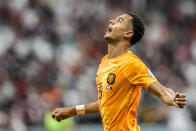 Cody Gakpo of the Netherlands celebrates after scoring his side's opening goal during the World Cup group A soccer match between the Netherlands and Qatar, at the Al Bayt Stadium in Al Khor , Qatar, Tuesday, Nov. 29, 2022. (AP Photo/Moises Castillo)