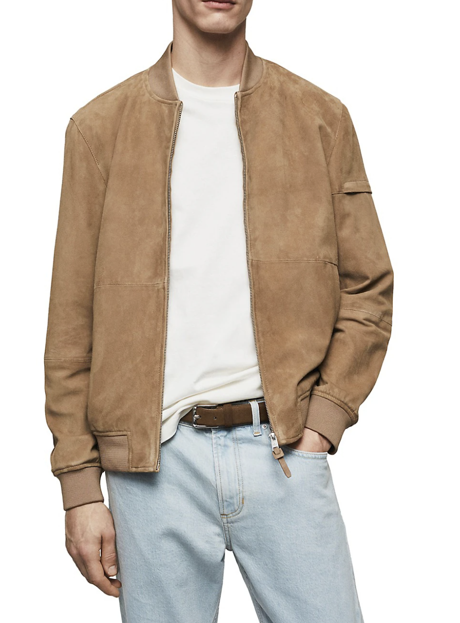 man wearing light brown Mango Grus Suede Bomber Jacket with white t-shirt and blue jeans (photo via The Bay)