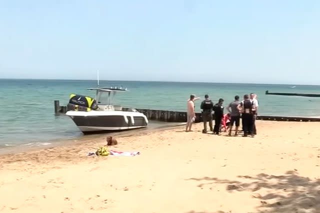 A photo of fire rescue on the scene of the incident at Lake Michigan.