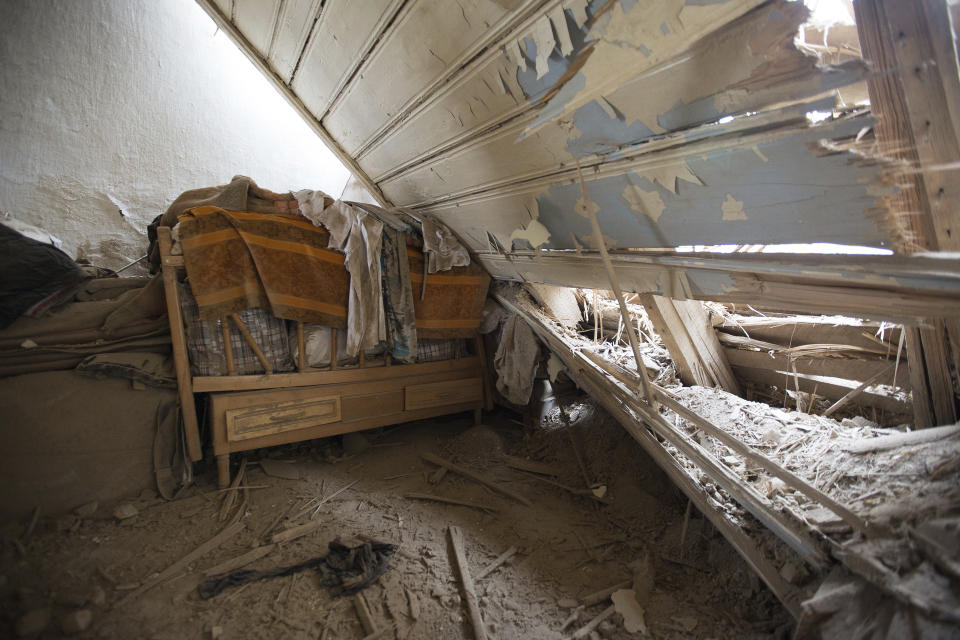 A damaged house after an Azerbaijan forces artillery attack in the town of Martuni, self-proclaimed Republic of Nagorno-Karabakh, Azerbaijan, Thursday, Oct. 1, 2020. Two French and two Armenian journalists have been injured in the South Caucasus separatist region of Nagorno-Karabakh, where heavy fighting between Armenian and Azerbaijani forces this week marked the biggest escalation in years of a decades-old conflict. (Areg Balayan /ArmGov PAN Photo via AP)