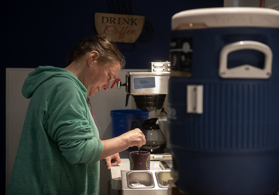 Laura Rabich, of Kent, fixes a cup of coffee at Kent Social Services. She's concerned how she will cope with the end of a temporary boost to Supplemental Nutrition Assistance Program (SNAP) benefits beginning in March.