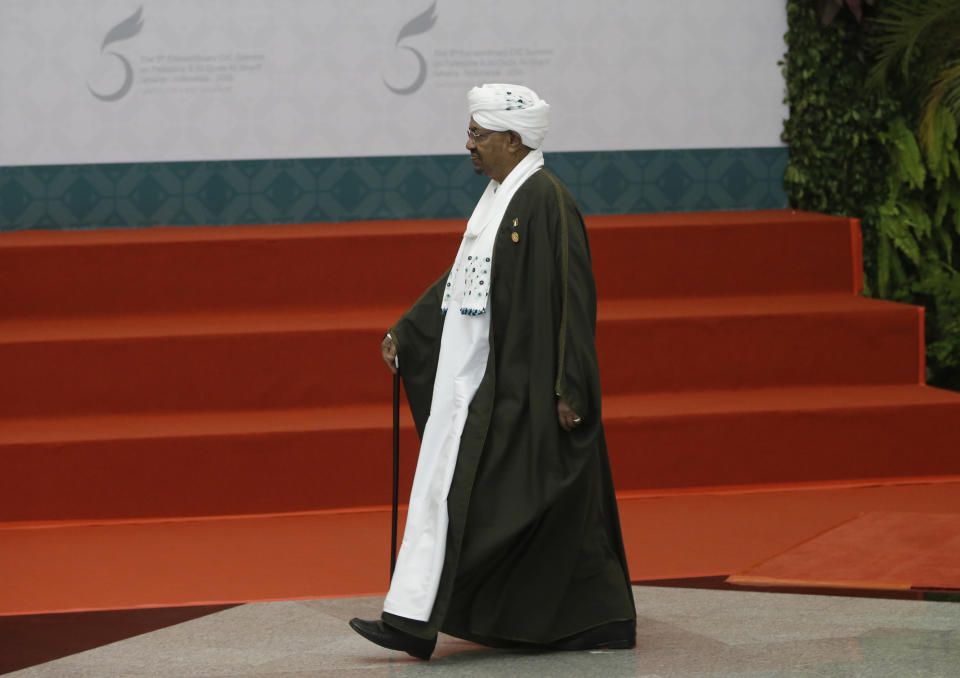 FILE -- In this March 7, 2016 file photo, Sudan's President Omar al Bashir walks to the stage at the extraordinary Organization of Islamic Cooperation summit, in Jakarta, Indonesia. Sudan's official news agency said Monday, March 27, 2017, that al-Bashir will attend the Arab Summit in Jordan this week, despite a long-standing warrant for his arrest by the International Criminal Court on charges of war crimes and genocide. The international group Human Rights Watch has urged Jordan to deny entry to al-Bashir or arrest him, citing the kingdom's obligations as an ICC member. Jordan says that as an Arab League member, Sudan has the right to attend the meeting of Arab leaders. (AP Photo/Dita Alangkara, File)