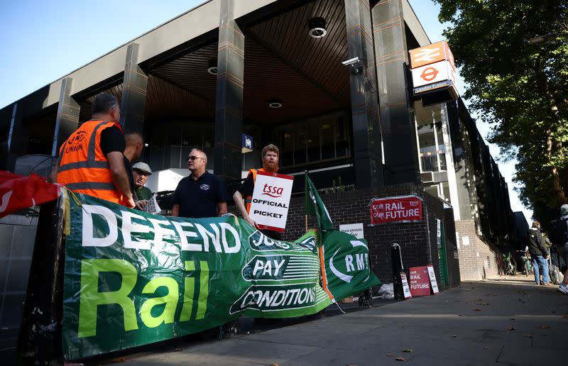 British railways workers go on strike over pay and terms