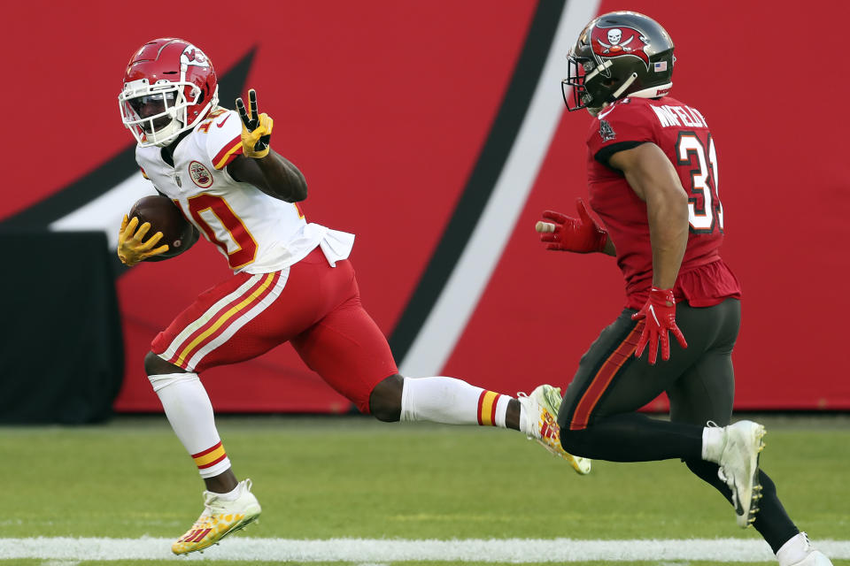 FILE - In this Nov. 29, 2020 file photo, Kansas City Chiefs wide receiver Tyreek Hill (10) reacts as he beats Tampa Bay Buccaneers strong safety Antoine Winfield Jr. (31) on a 75-yard touchdown reception during the first half of an NFL football game in Tampa, Fla. Hill was unstoppable against Tampa Bay in late November. The speedy Kansas City star caught 13 passes for 269 yards and three touchdowns in the Chiefs' 27-24 victory that afternoon. Tampa Bay gets another shot at Hill and the Chiefs in the Super Bowl on Sunday, Feb. 7, 2021. (AP Photo/Mark LoMoglio, File)