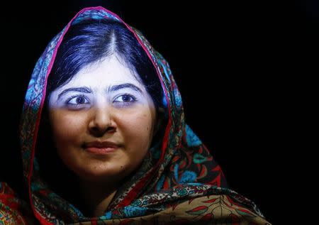 Pakistani schoolgirl Malala Yousafzai, the joint winner of the Nobel Peace Prize, leaves after speaking at Birmingham library in Birmingham, central England October 10, 2014. REUTERS/Darren Staples