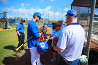 <p>New York Mets outfielder Tim Tebow signs for fans during spring training in Port St. Lucie, Fla., Feb. 23, 2018. (Photo: Gordon Donovan/Yahoo News) </p>