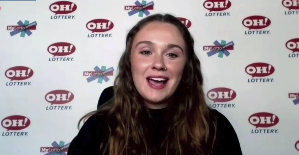 In this still image, taken from video by the Office of the Ohio Governor, Abbigail Bugenske, 22, from Cincinnati, the first winner of Ohio's first $1 million Vax-a-Million vaccination incentive prize, is interviewed during a news conference, Thursday, May 27, 2021. (Office of Ohio Governor via AP)