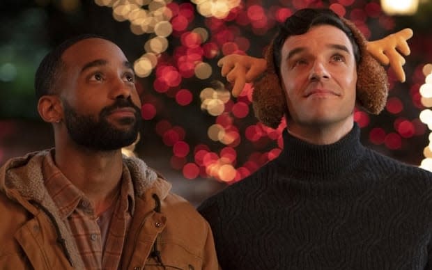 Philemon Chambers and Michael Urie in the Christmas movie "Single All the Way" on <a href="https://parade.com/1015716/samuelmurrian/best-movies-on-netflix/" rel="nofollow noopener" target="_blank" data-ylk="slk:Netflix;elm:context_link;itc:0;sec:content-canvas" class="link ">Netflix</a><p>Netflix</p>