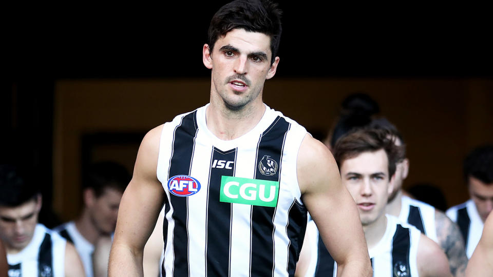 Scott Pendlebury of the Magpies leads team mates onto the field on July 20, 2019 in Sydney, Australia. (Photo by Cameron Spencer/Getty Images)